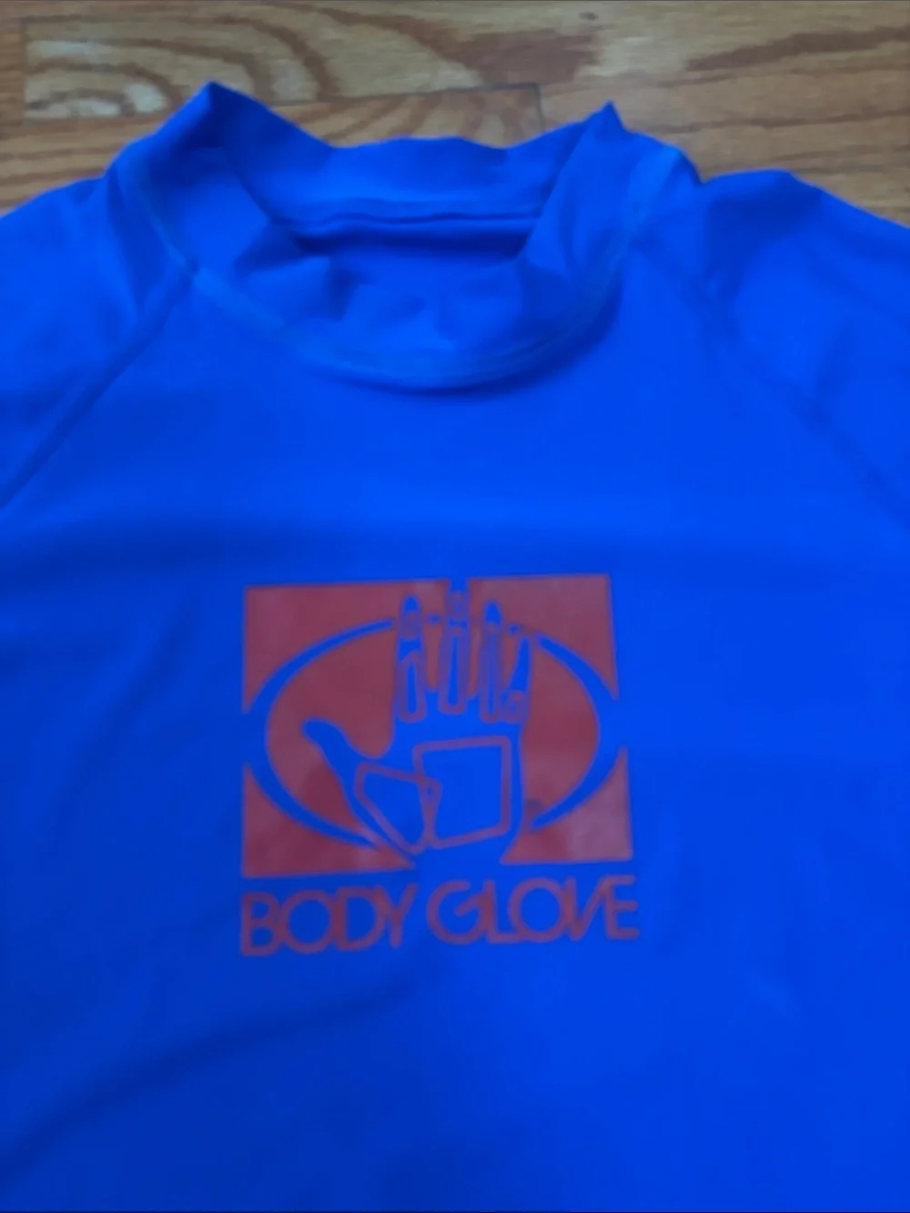 Body Glove blue and red rash guard tops
